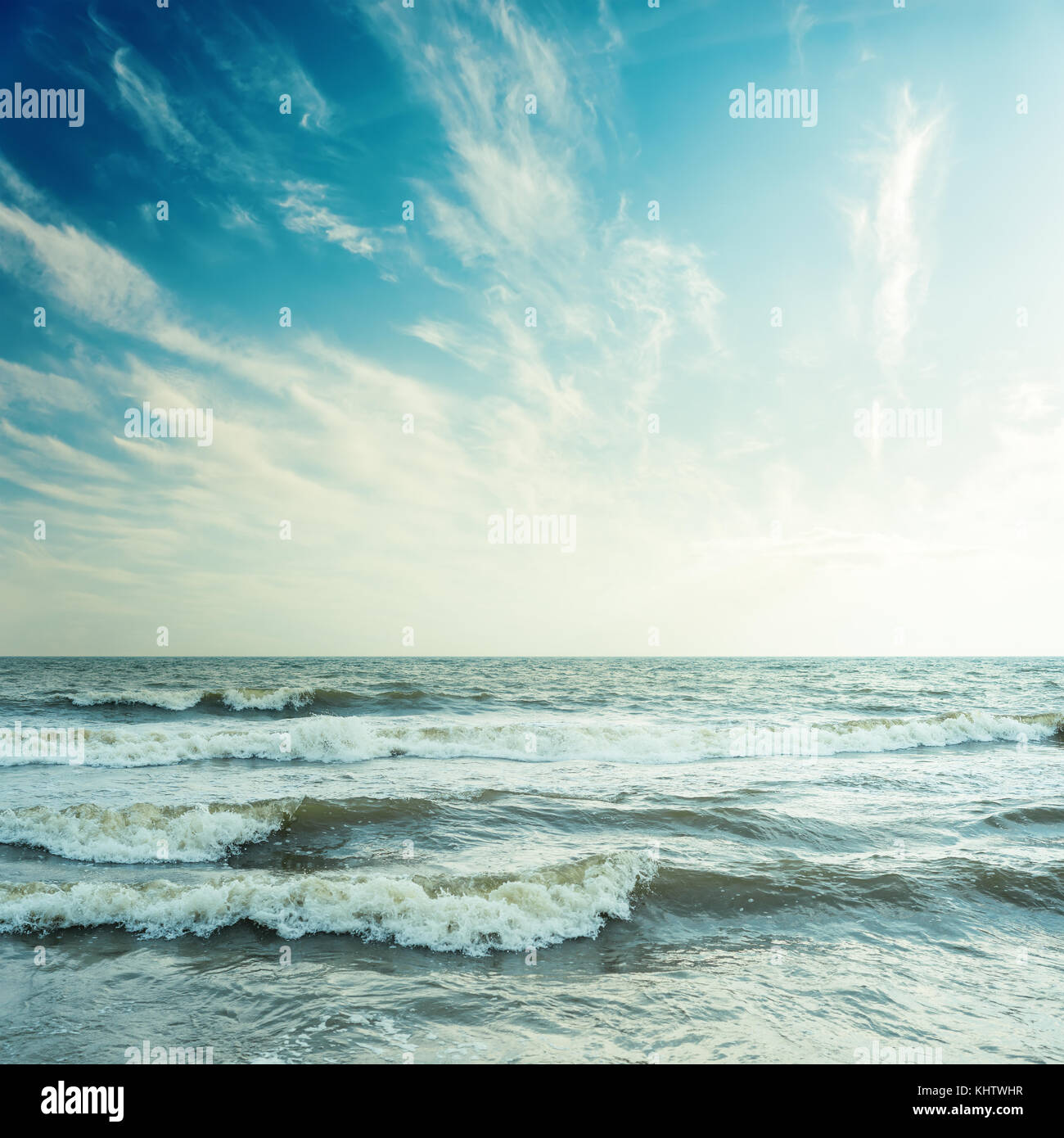 blue sky with clouds and stormy sea in sunset Stock Photo - Alamy