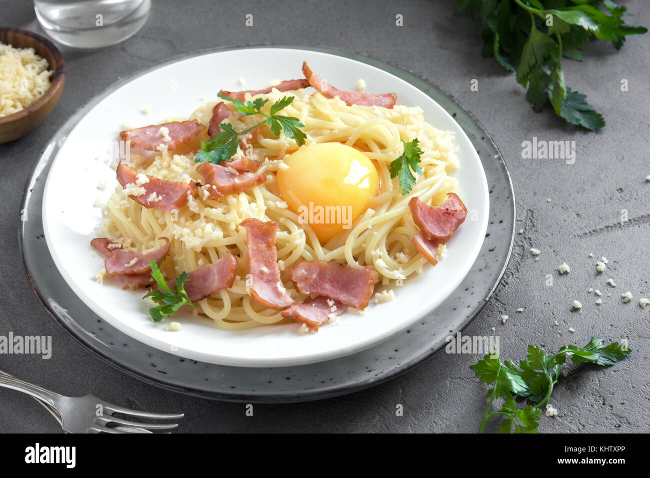 Spaghetti carbonara pasta with egg sauce, bacon and grated parmesan
