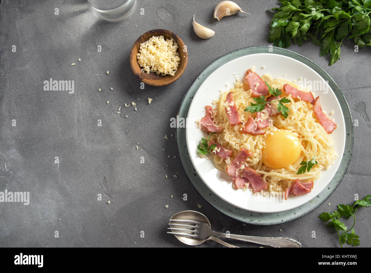 Spaghetti carbonara pasta with egg sauce, bacon and grated parmesan