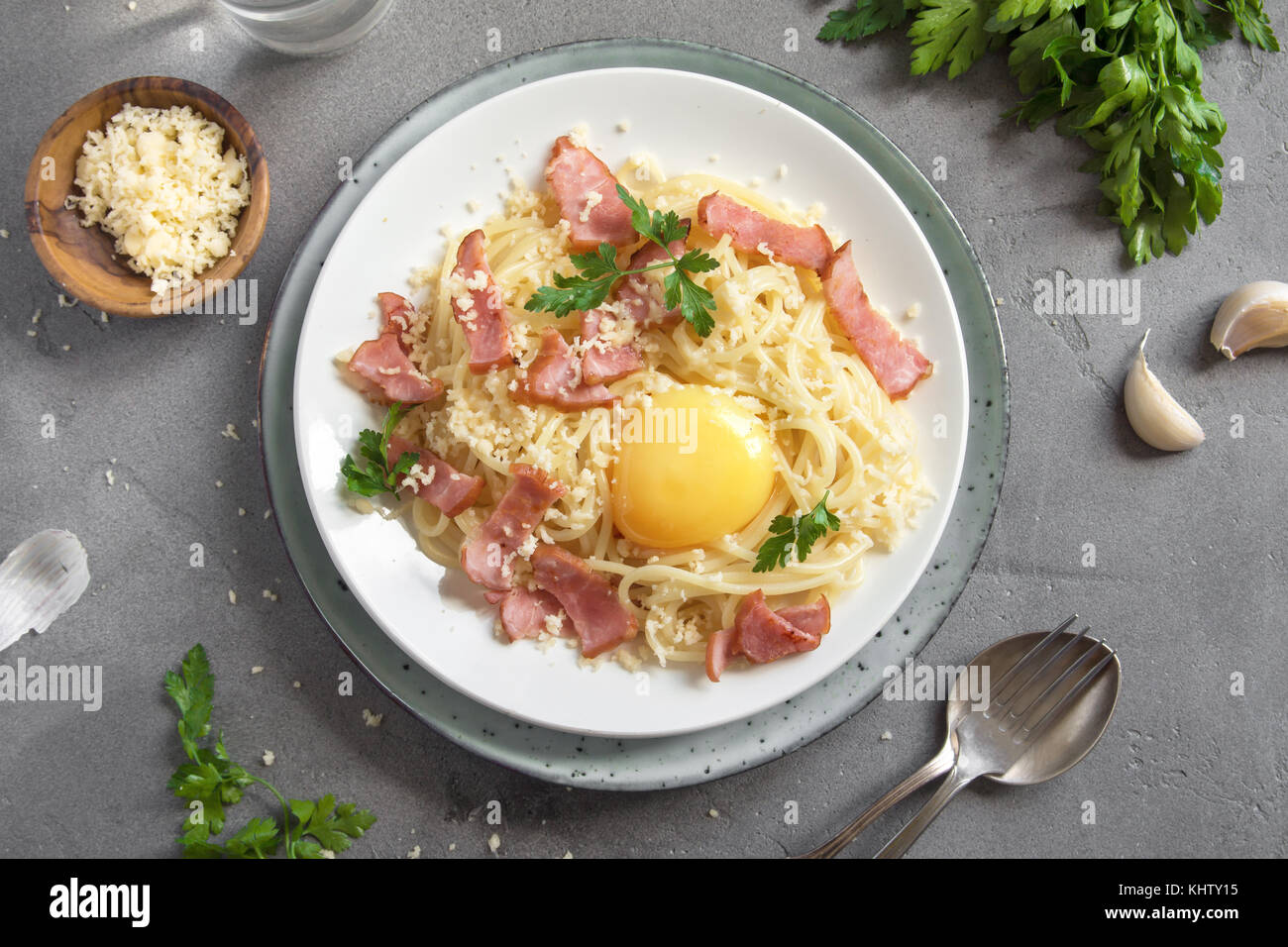 Spaghetti carbonara pasta with egg sauce, bacon and grated parmesan