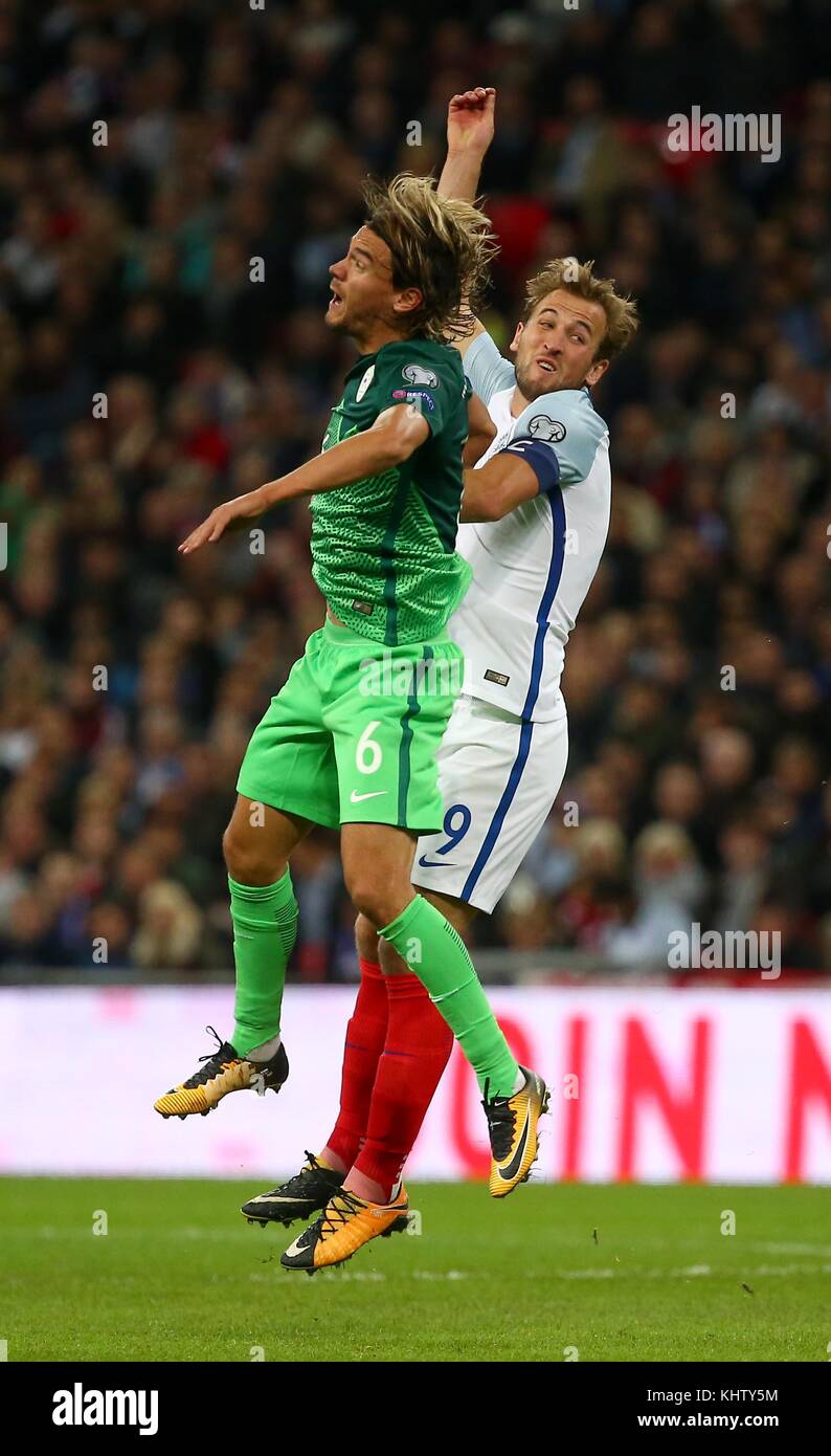 Harry Kane of England challenges Rene Krhin of Slovenia during the FIFA World Cup Qualifier match between England and Slovenia at Wembley Stadium in London. 05 Oct 2017 *** EDITORIAL USE ONLY *** No merchandising. For Football images FA and Premier League restrictions apply inc. no internet/mobile usage without FAPL license - for details contact Football Dataco Stock Photo