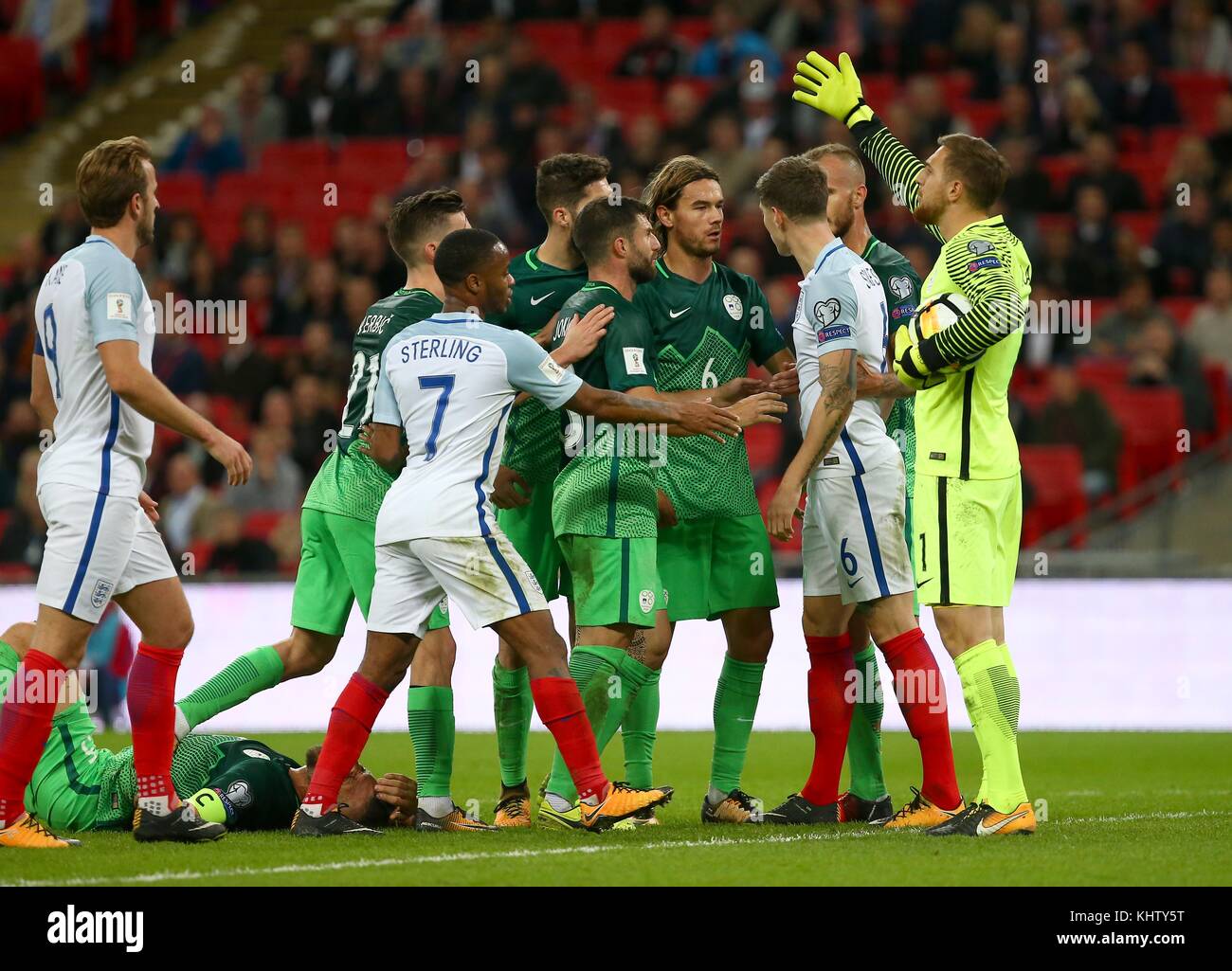 John Stones of England has words with Rene Krhin of Slovenia during the FIFA World Cup Qualifier match between England and Slovenia at Wembley Stadium in London. 05 Oct 2017 *** EDITORIAL USE ONLY *** No merchandising. For Football images FA and Premier League restrictions apply inc. no internet/mobile usage without FAPL license - for details contact Football Dataco Stock Photo