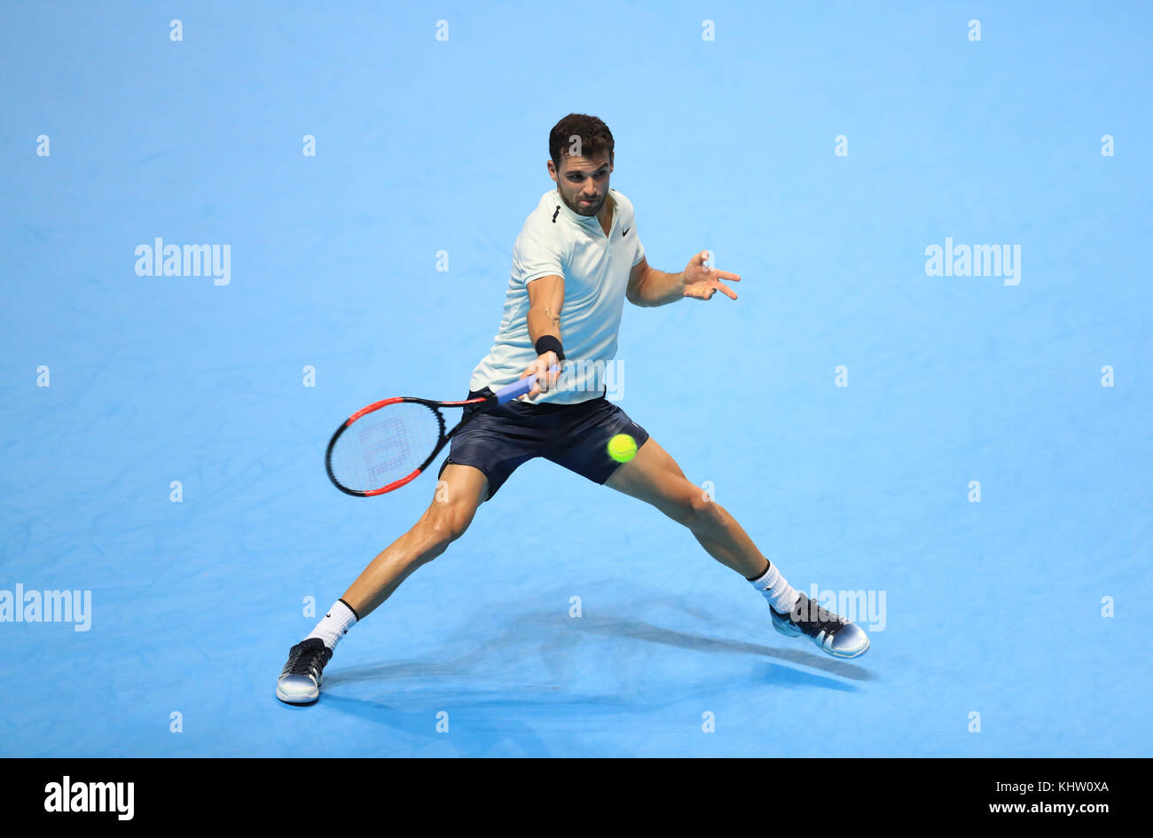 Grigor Dimitrov in action against David Goffin in the Men's Singles Final during day eight of the NITTO ATP World Tour Finals at the O2 Arena, London. PRESS ASSOCIATION Photo. Picture date: Sunday November 19, 2017. See PA story TENNIS London. Photo credit should read: Adam Davy/PA Wire. Stock Photo