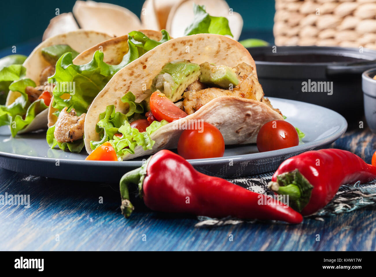 Authentic mexican tacos with chicken and salsa with avocado, tomatoes and chillies. Mexican