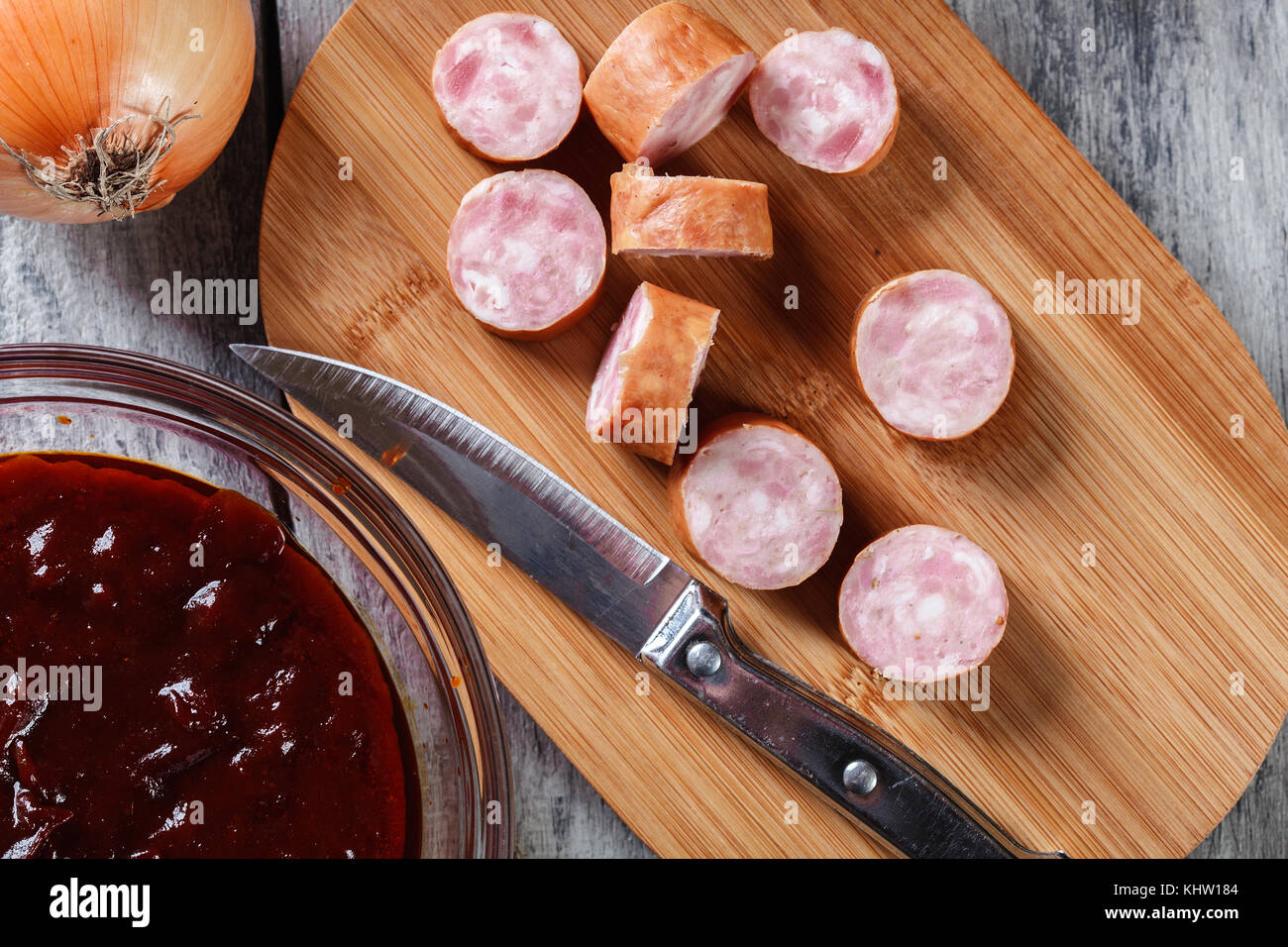 Ingredients ready for preparing German currywurst with curry sauce