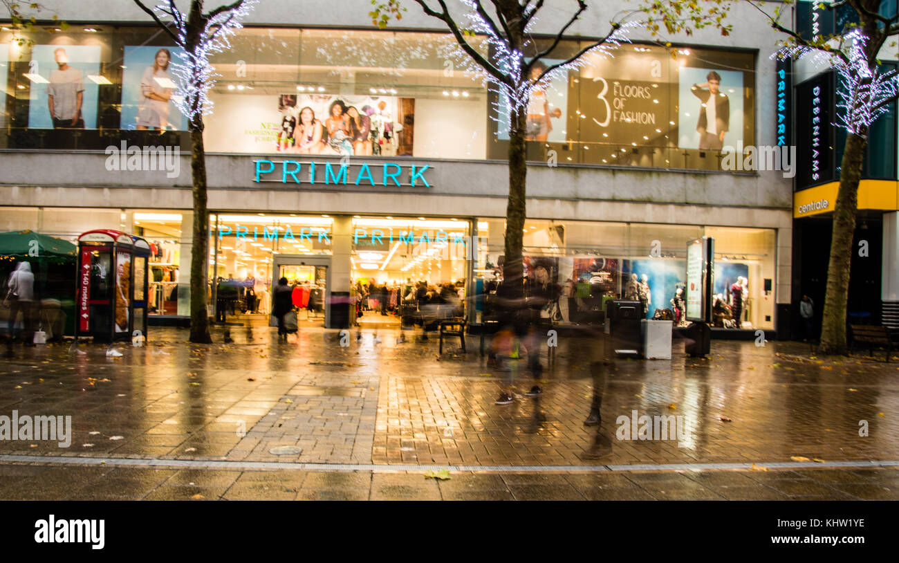 Croydon high street shops with Christmas lights ON showing the Whitgift