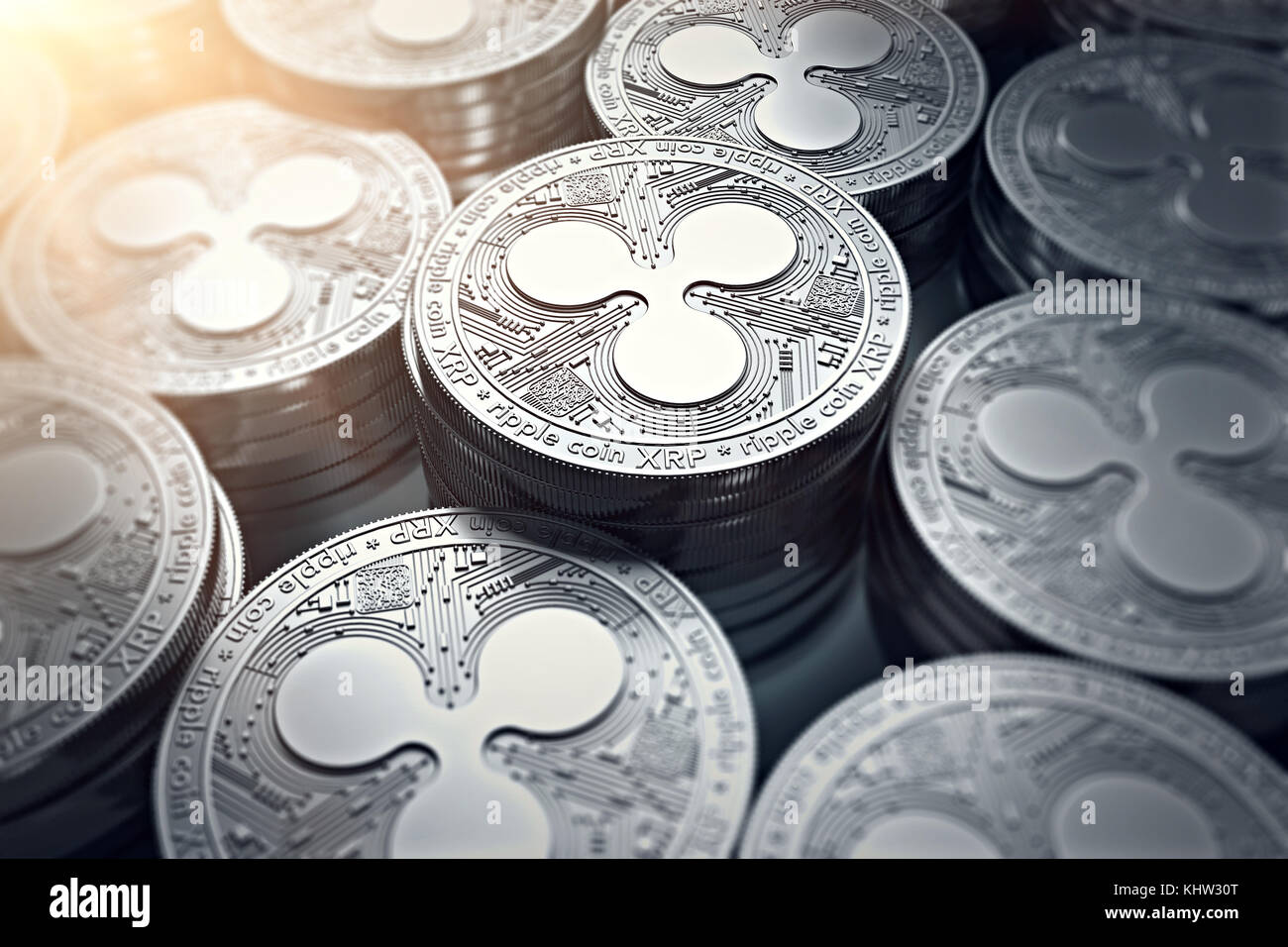 Ripple coins (XRP) in blurry closeup with sun flare. New cryptocurrency and modern banking concept. 3D rendering. Stock Photo