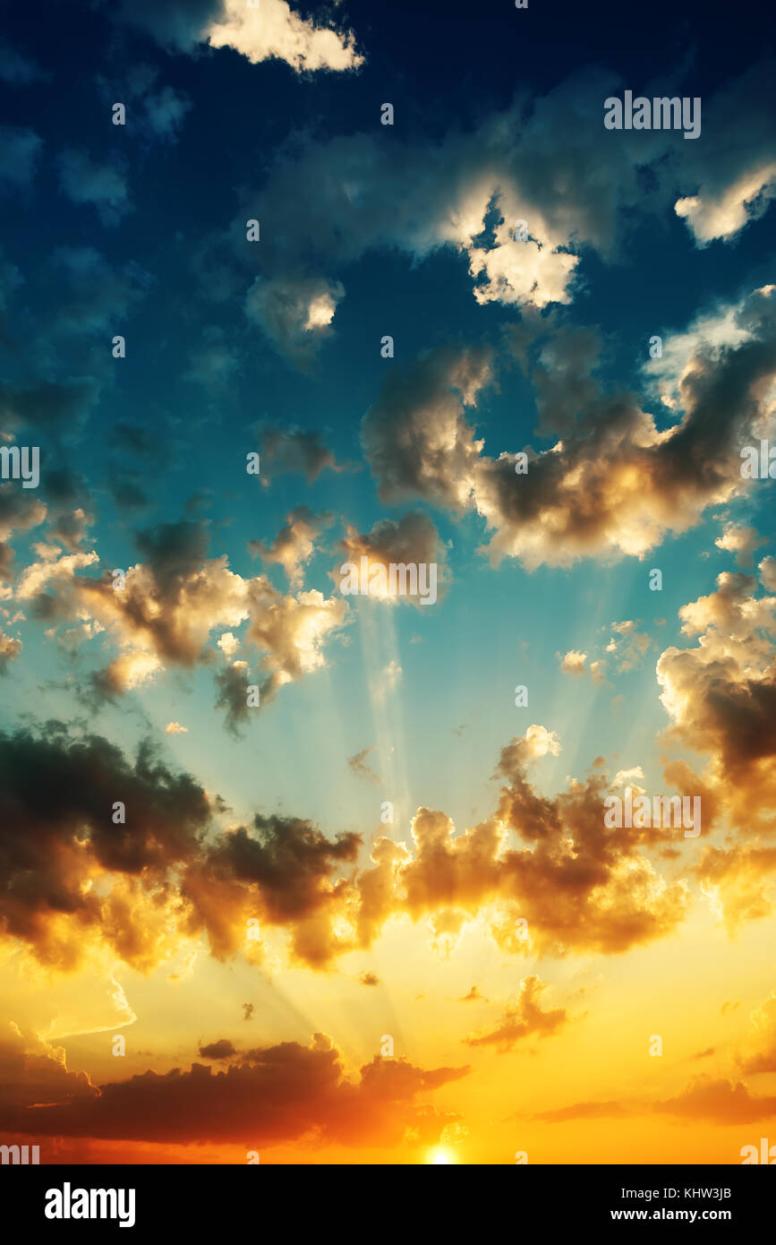 sunset with clouds, light rays and other atmospheric effect Stock Photo ...