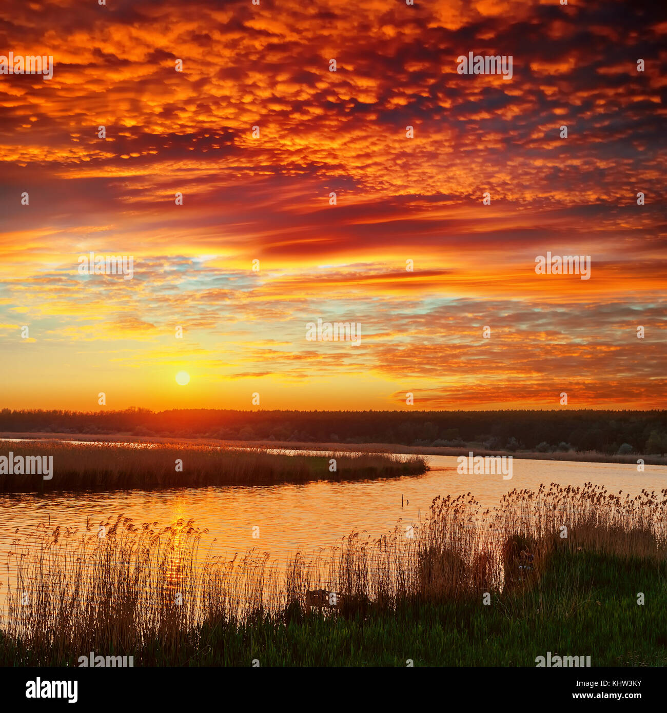 red dramatic sunset over river Stock Photo - Alamy