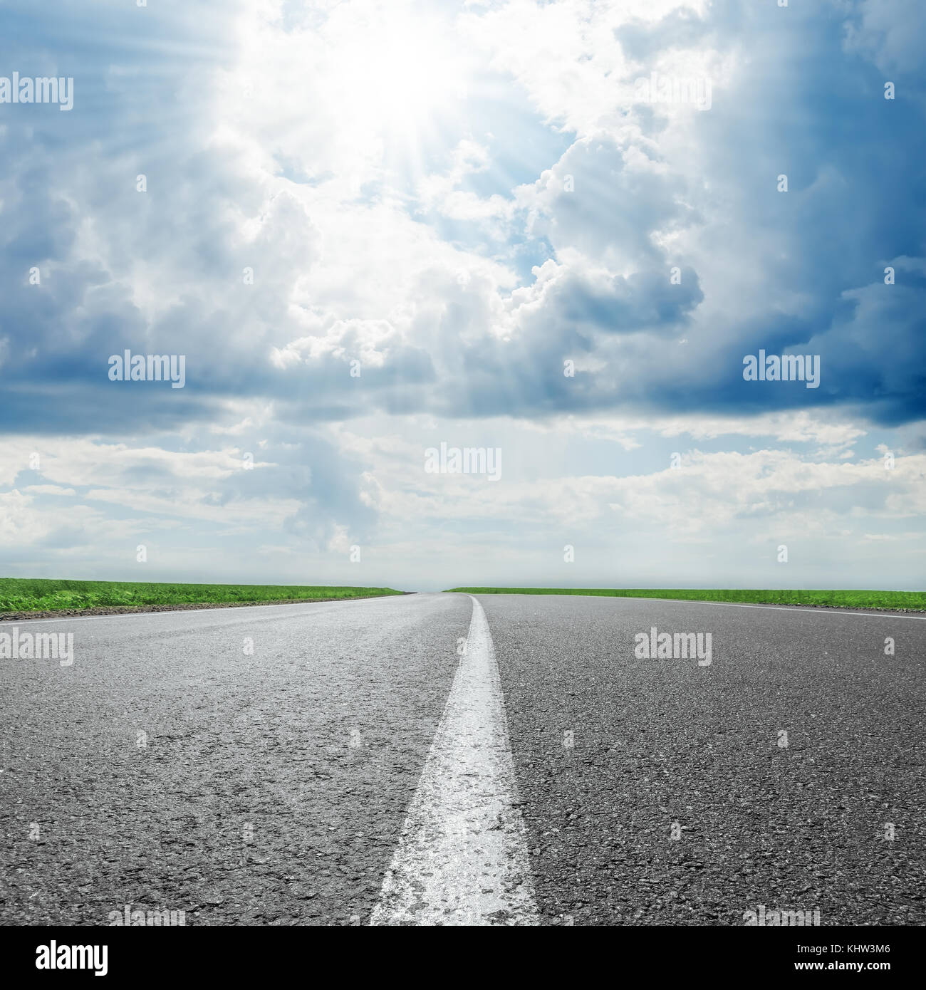 sun in clouds and asphalt road to horizon Stock Photo - Alamy