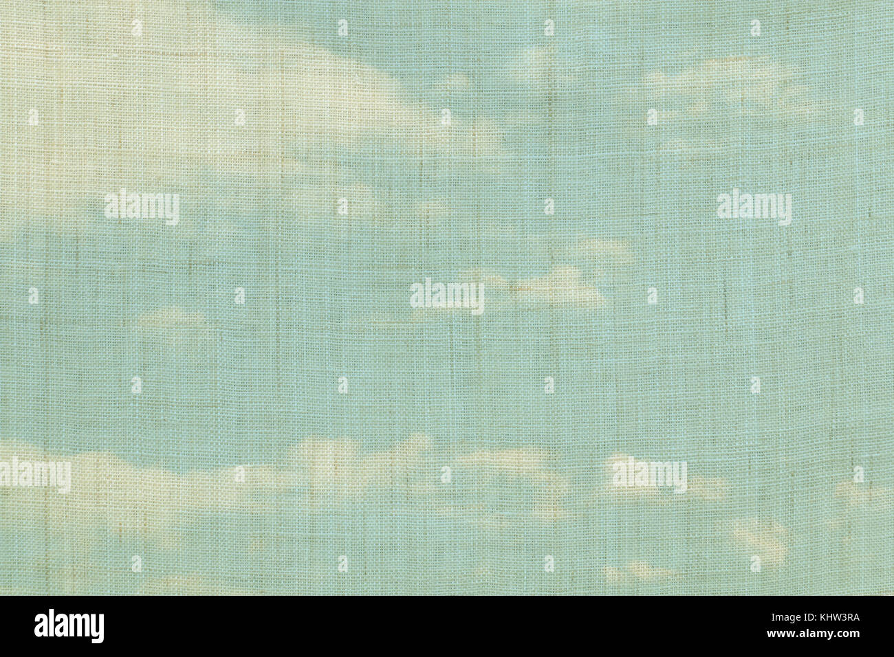 beige colored hemp cloth texture with blue sky background Stock Photo