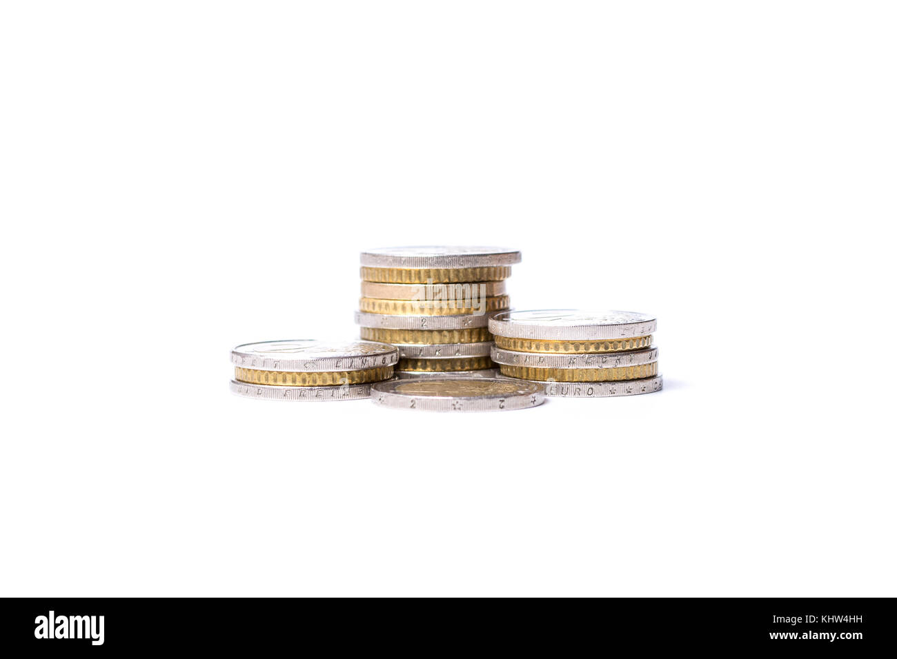 Several stacks of Euro coins on white background Stock Photo - Alamy