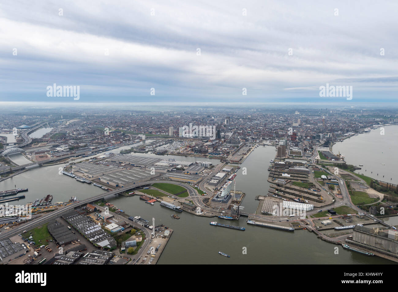 Aerial image looking from the Port of Antwerp to the city of Antwerp with the Nieuw Havenhuis en het Pomphuis in the foreground Stock Photo