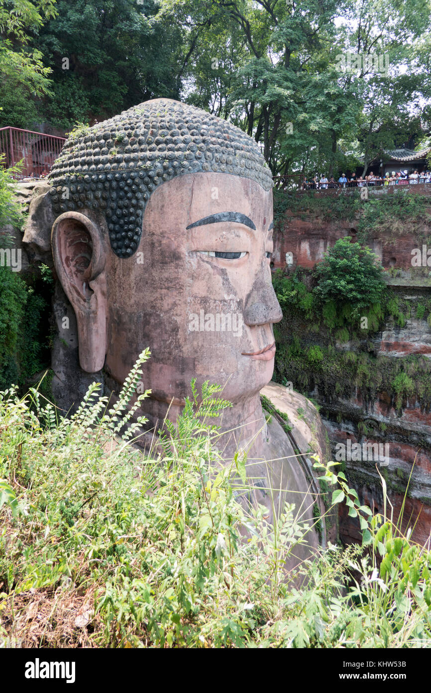 The Leshan Giant Buddha carved out of a cliff where the Min and Dadu rivers meet near Leshan, Sichuan, China, Asia. The largest and tallest stone Budd Stock Photo