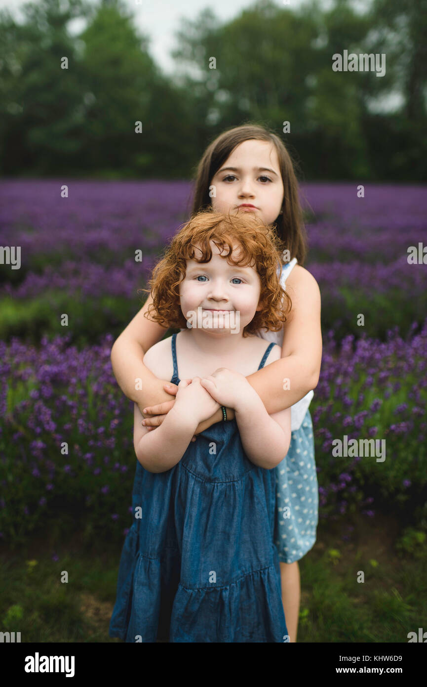 Sisters in lavender field, Campbellcroft, Canada Stock Photo