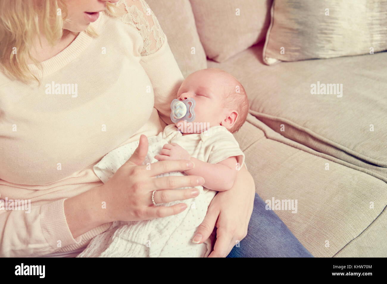 Newborn baby boy, sleeping in mother's arms Stock Photo Alamy