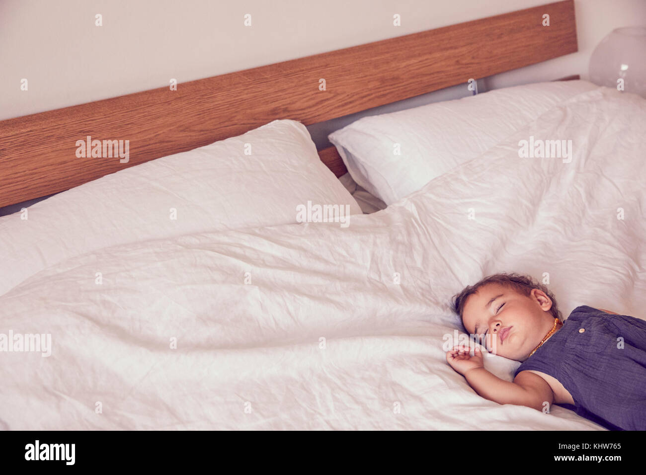 Female toddler, sleeping on bed Stock Photo Alamy