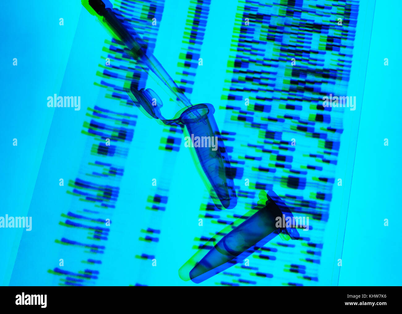 Genetic research, pipette and DNA samples on DNA autoradiogram illustrating research into life sciences and genetic modification Stock Photo