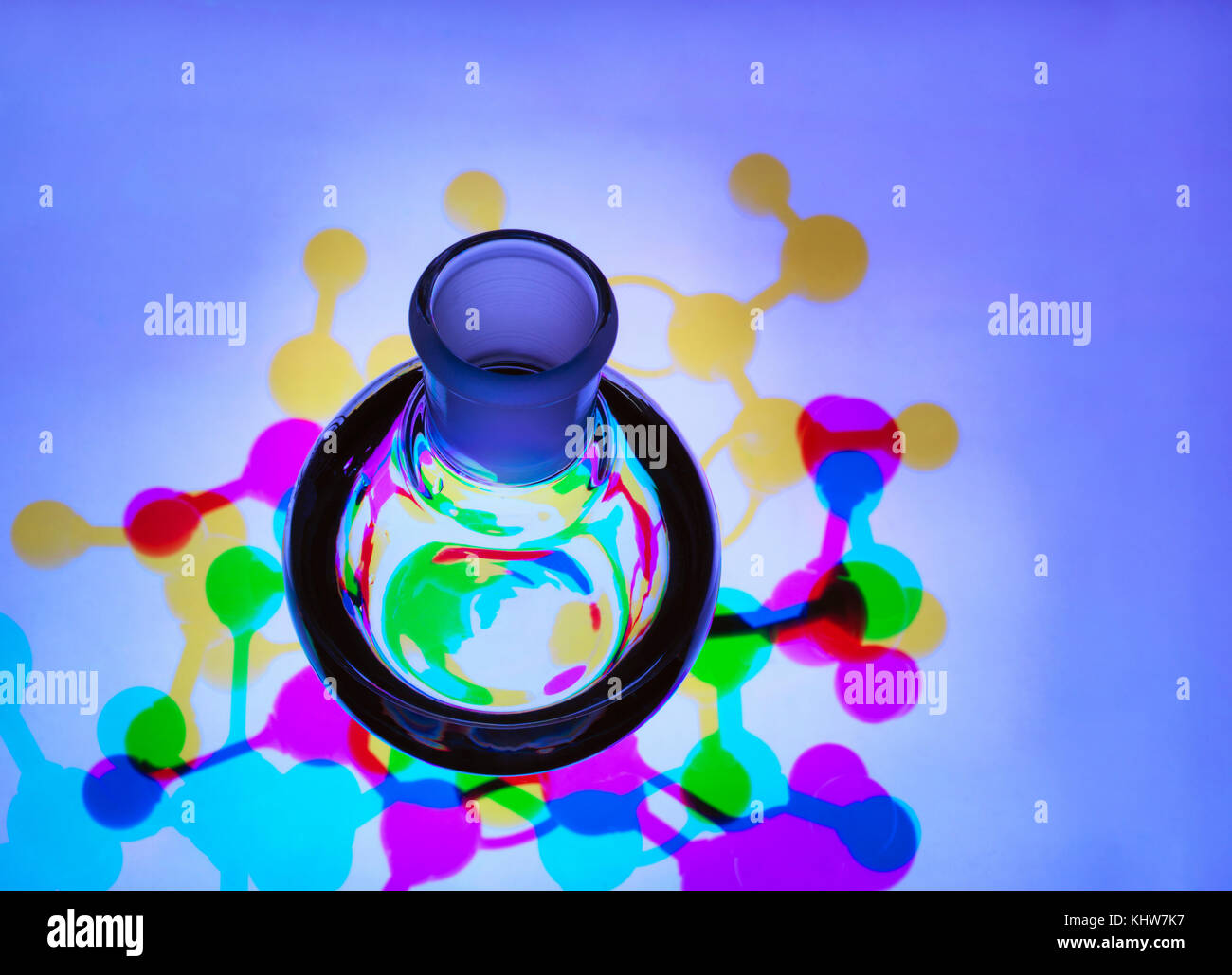Laboratory flask containing a chemical formula with molecular structure background - illustrating research Stock Photo