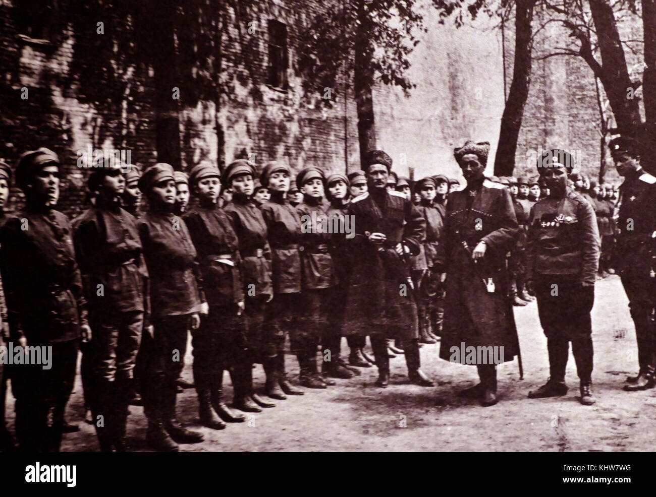 Photograph taken depicts two fur-hatted officers inspecting troops of the Women's Battalion, under the watchful eye of the unit's commander, Madame Botchkareva (second from right). Formed largely of war widows, the group supported Alexander Kerensky's government. Dated 20th Century Stock Photo