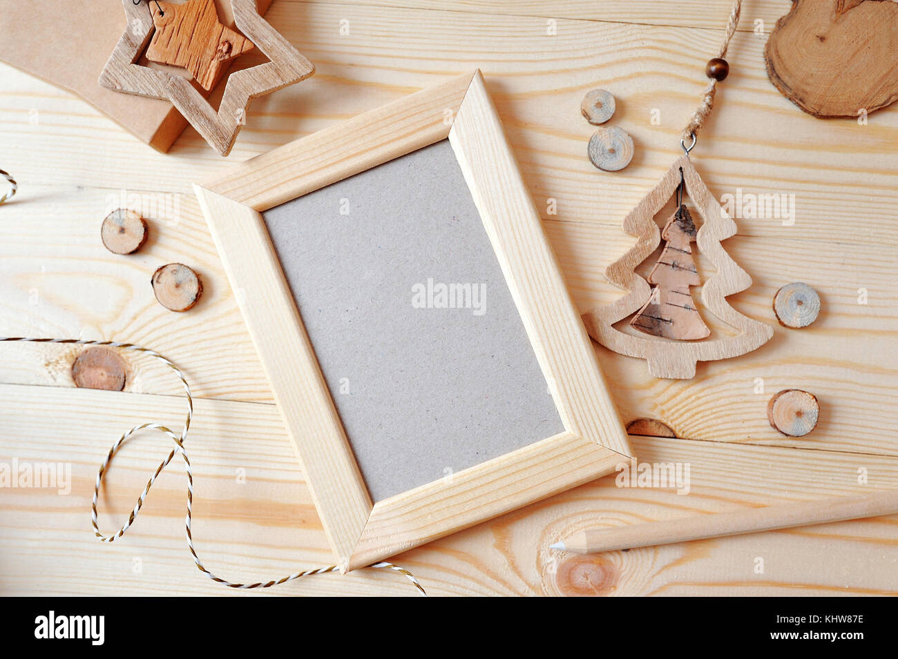 Wooden frame Christmas mockup, stock photography. Design works presentations, for bloggers and social media. Flat lay, top view photo mockup Stock Photo
