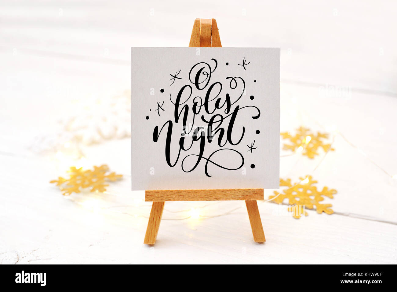 calligraphic text O holy night on an easel, christmas card holiday ...