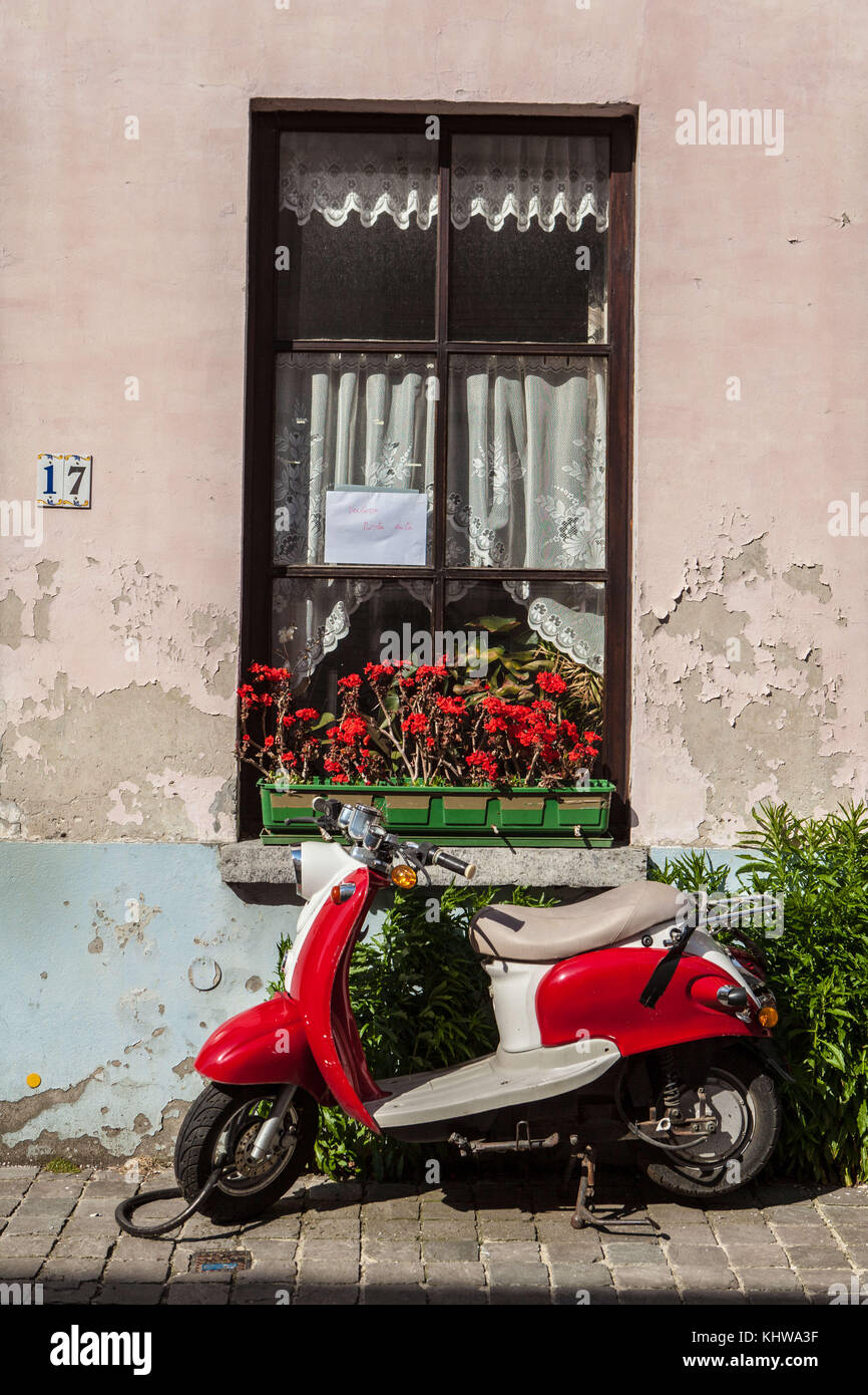 June 9, 2015 - Bruges, Belgium - A motor scooter rests against a windowsill on a side street in Bruges, Belgium. (Credit Image: © Alex Edelman via ZUMA Wire) Stock Photo