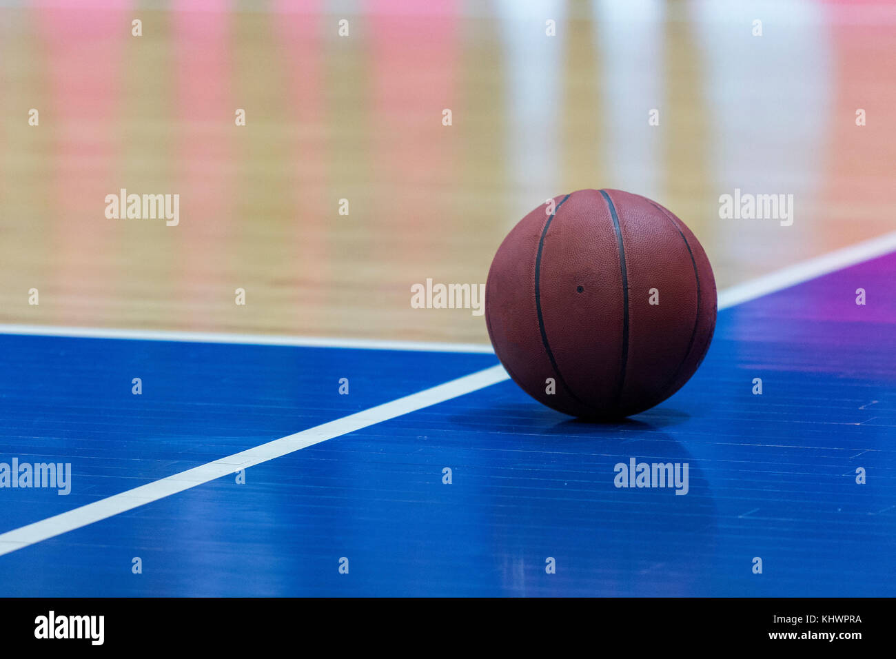 Basketball ball on playing court Stock Photo Alamy