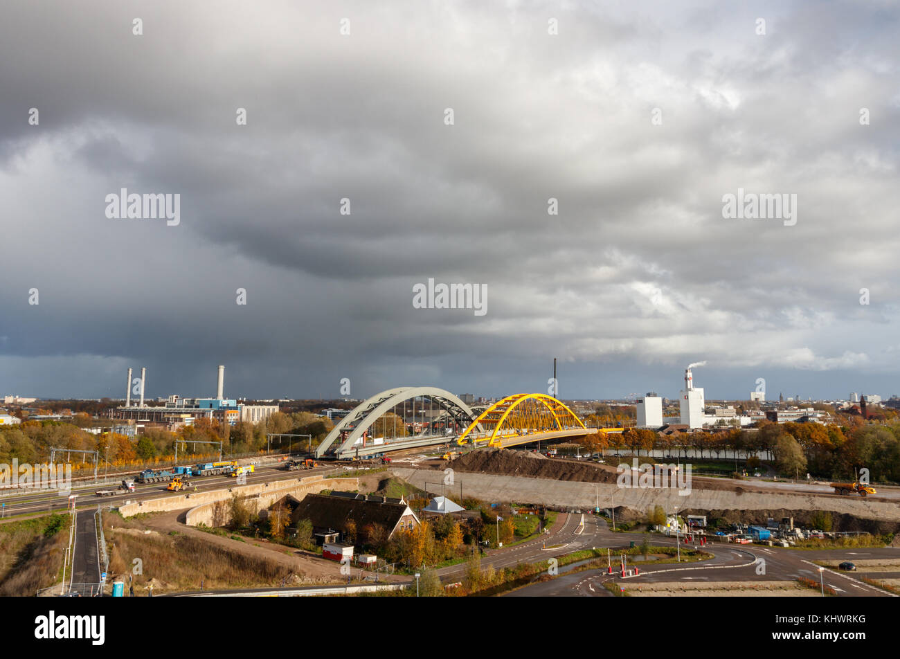 Construction site of the new Amsterdam-Rhine Canal railway bridge under a cloudy sky. Utrecht, The Netherlands. Stock Photo