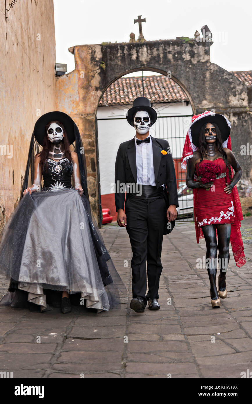 Mexican teens dressed in La Calavera Catrina and Dapper Skeleton costumes  for the Day of the Dead or Día de Muertos festival October 31, 2017 in  Patzcuaro, Michoacan, Mexico. The festival has