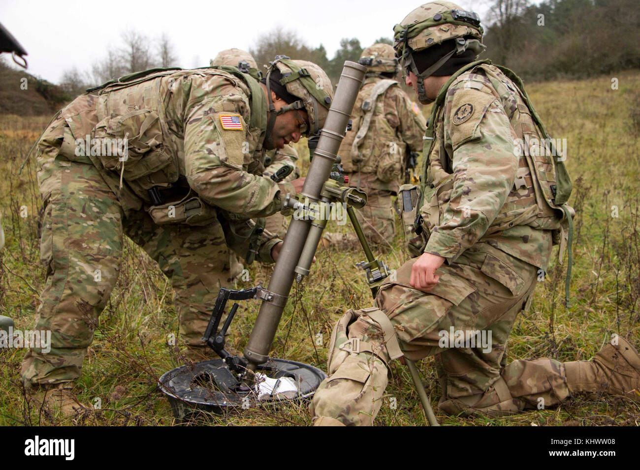A mortar squad in Apache Troop, 1st Squadron, 2d Cavalry Regiment, practices a fire drill with their M224 60mm mortar system during Allied Spirit VII at the 7th Army Training Command’s Hohenfels Training Area, Germany Nov. 16, 2017. Mortarmen can move and emplace their system then fire it quickly and accurately on the battlefield. Allied Spirit is a U.S. Army Europe-directed, 7ATC-conducted multinational exercise series designated to develop and enhance NATO nations interoperability and readiness. Stock Photo