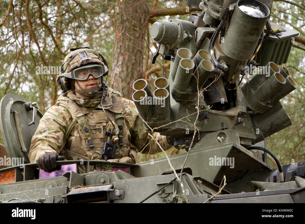 A Soldier from 1st Squadron, 2d Cavalry Regiment in a Stryker Combat Vehicle takes part in a battle against opposing forces during Allied Spirit VII at the 7th Army Training Command's Hohenfels Training Area, Germany, Oct. 30 to Nov. 22, 2017. Allied Spirit is a U.S. Army Europe-directed, 7ATC-conducted multinational exercise series designated to develop and enhance NATO nations interoperability and readiness. Stock Photo