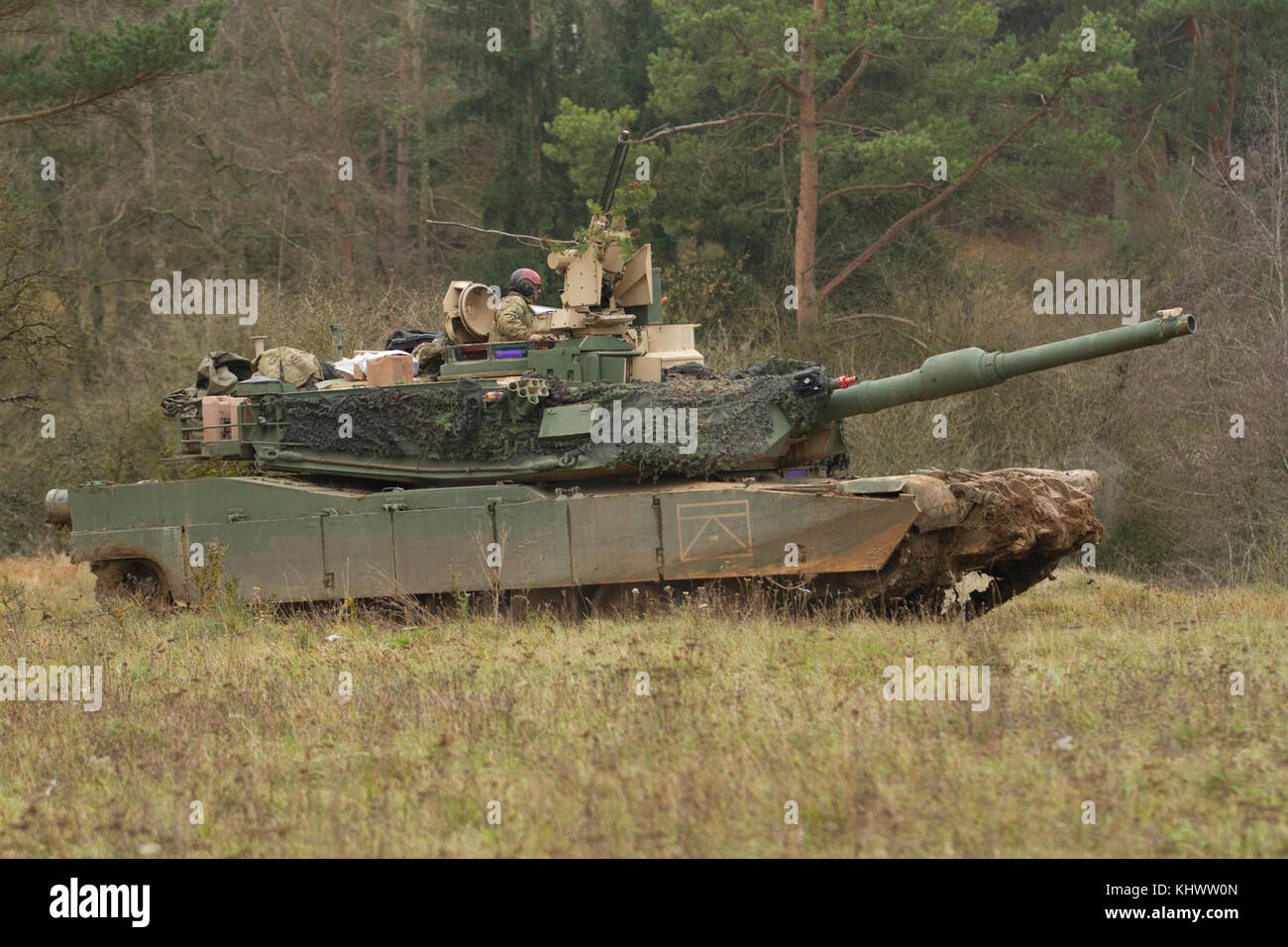 Soldiers from 2nd Armored Brigade, 1st Infantry Division in their M1A2 SEPv2 Abrams Main Battle Tank, conduct a battle against opposing forces during Allied Spirit VII at the 7th Army Training Command's Hohenfels Training Area, Germany, Oct. 30 to Nov. 22, 2017. Allied Spirit is a U.S. Army Europe-directed, 7ATC-conducted multinational exercise series designated to develop and enhance NATO nations interoperability and readiness. Stock Photo