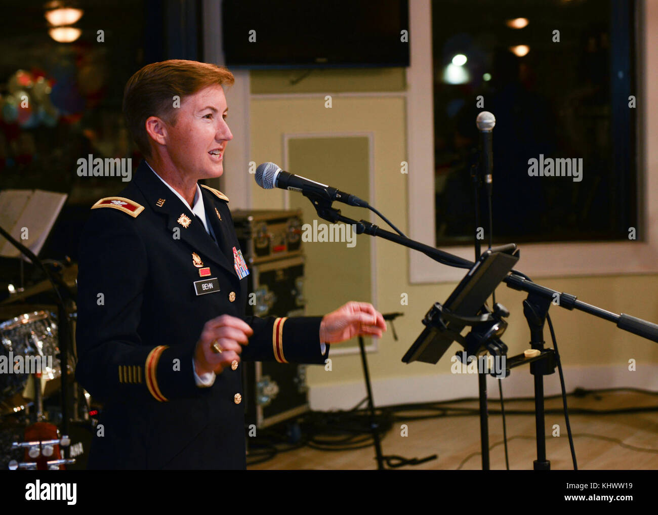 U.S. Army. Col. Beth A. Behn, 7th Transportation Brigade (Expeditionary) commander, gives opening remarks during the seventh annual “Thanks for Giving” holiday social for Gold Star families at Joint Base Langley-Eustis, Va., Nov. 16, 2017.  At this year’s event, families connected over music performed by the U.S. Army Training and Doctrine Command brass band, a meal served by community organizations and a talent showcase. (U.S. Air Force photo by Tech. Sgt. Katie Gar Ward) Stock Photo