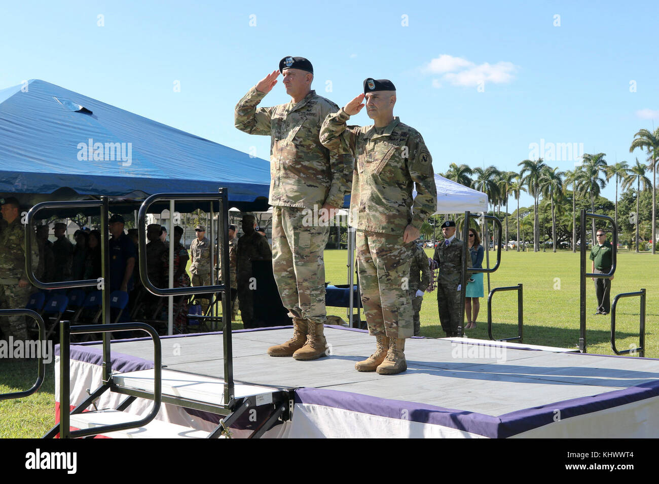 General Robert Brown, commanding general of U.S. Army Pacific, and Command Sgt. Maj. Benjamin Jones, incoming command sergeant major of U.S. Army Pacific, salute during USARPAC’s change of responsibility ceremony Nov. 17 at Historic Palm Circle on Fort Shafter, Hawaii. Command Sgt. Maj. Benjamin Jones assumed responsibility of U.S. Army Pacific from Command Sgt. Maj. Bryant Lambert, who held the position for more than three years. (U.S. Army Photo by Staff Sgt. Justin Silvers) Stock Photo