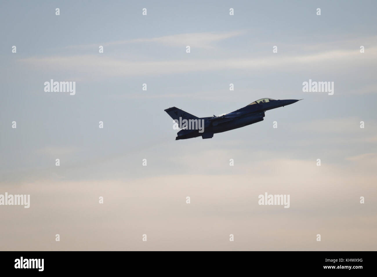 A New Jersey Air National Guard F-16C Fighting Falcon from the 177th Fighter Wing 'Jersey Devils' flies over Warren Grove Gunnery Range while on a training mission, Nov. 17, 2017. (U.S. Air National Guard photo by Master Sgt. Matt Hecht) Stock Photo