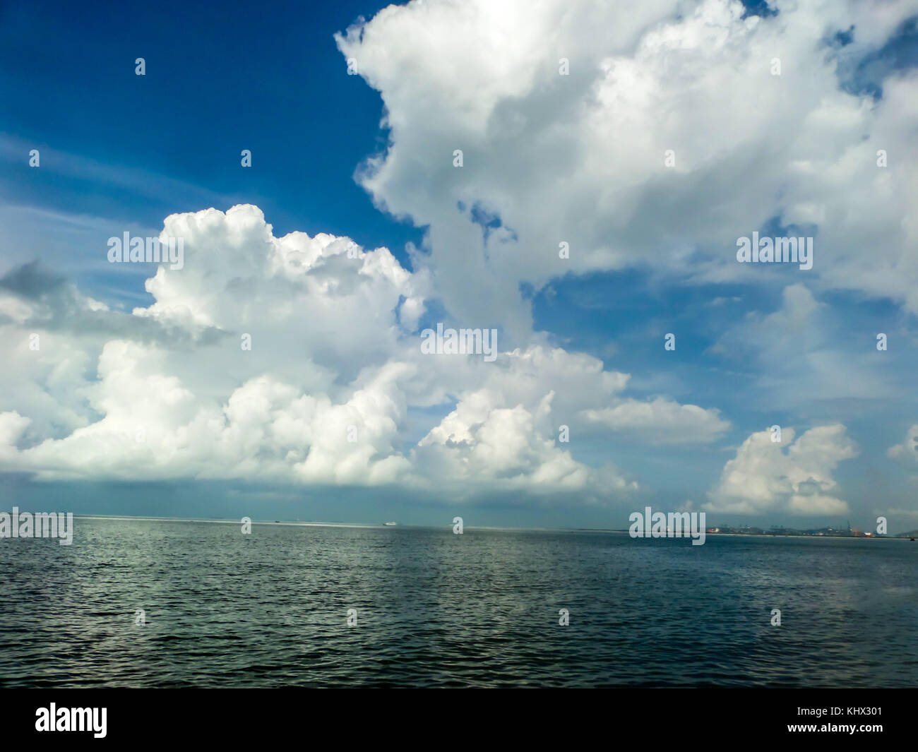 White cloud and the blue sky and sea and beach Stock Photo - Alamy