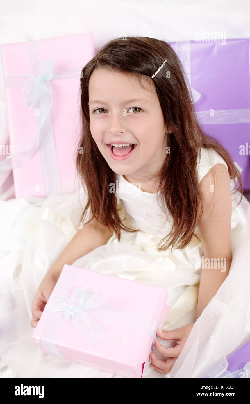 Little girl holding a present Stock Photo - Alamy