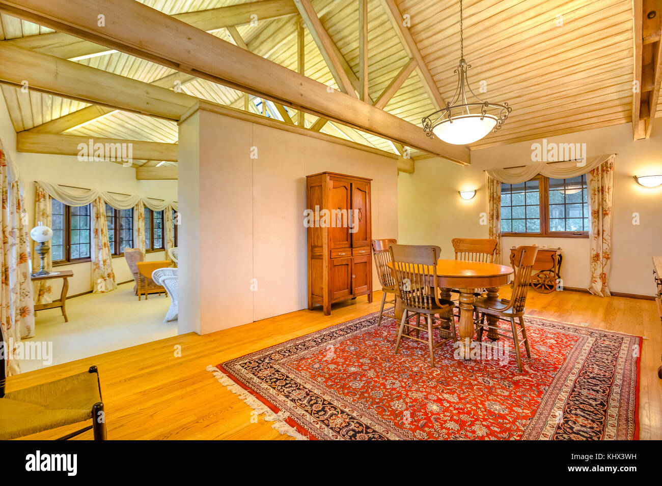 Bright Open And Warm Dining Room With Vaulted Ceilings And Sleek