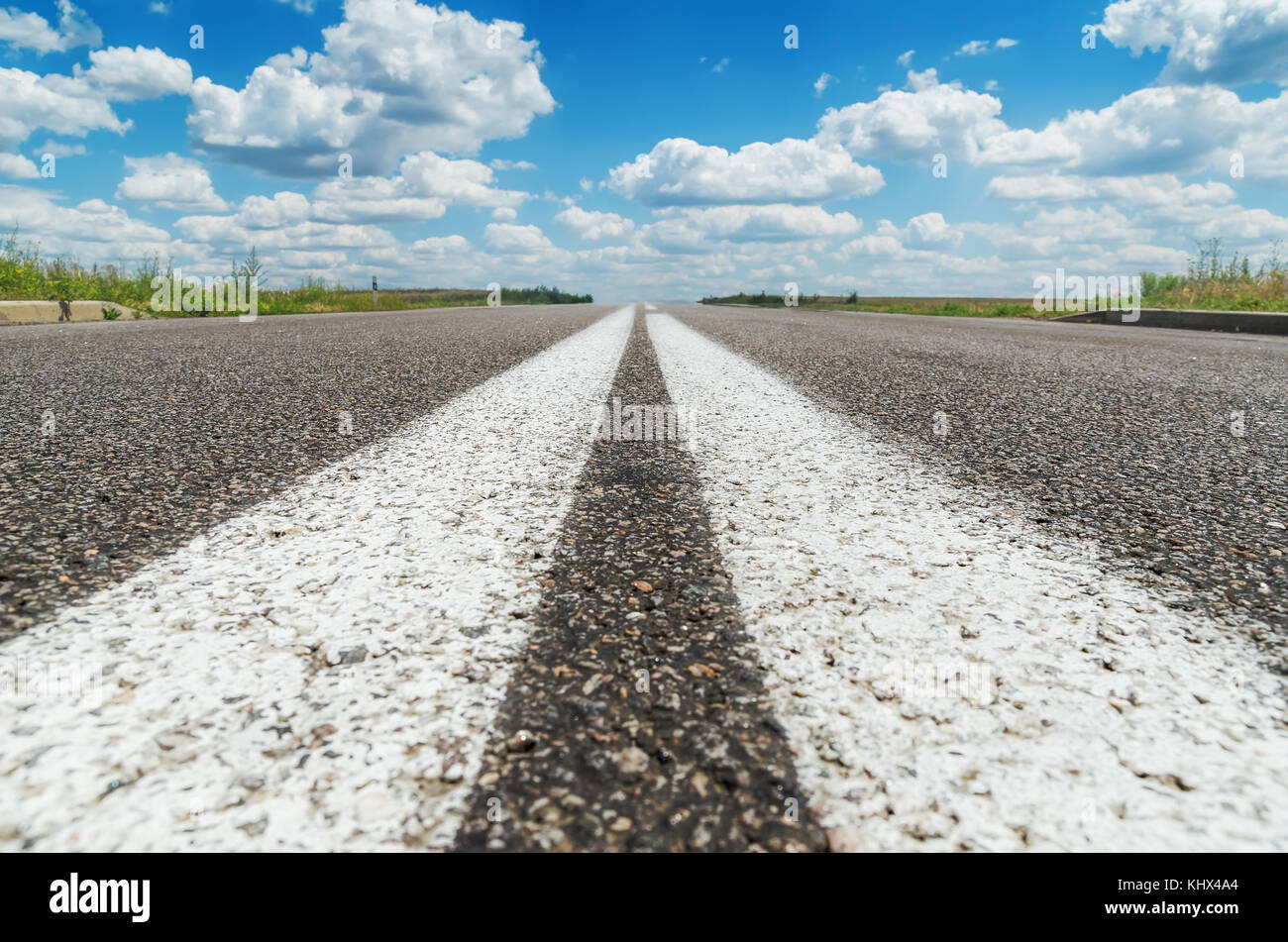 two white line on asphalt road closeup Stock Photo Alamy