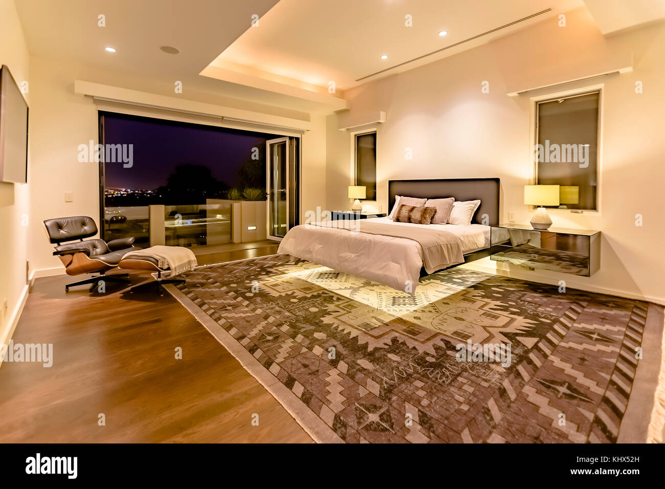 Lit bedroom of luxury California home upstairs penthouse. Wonderful ...