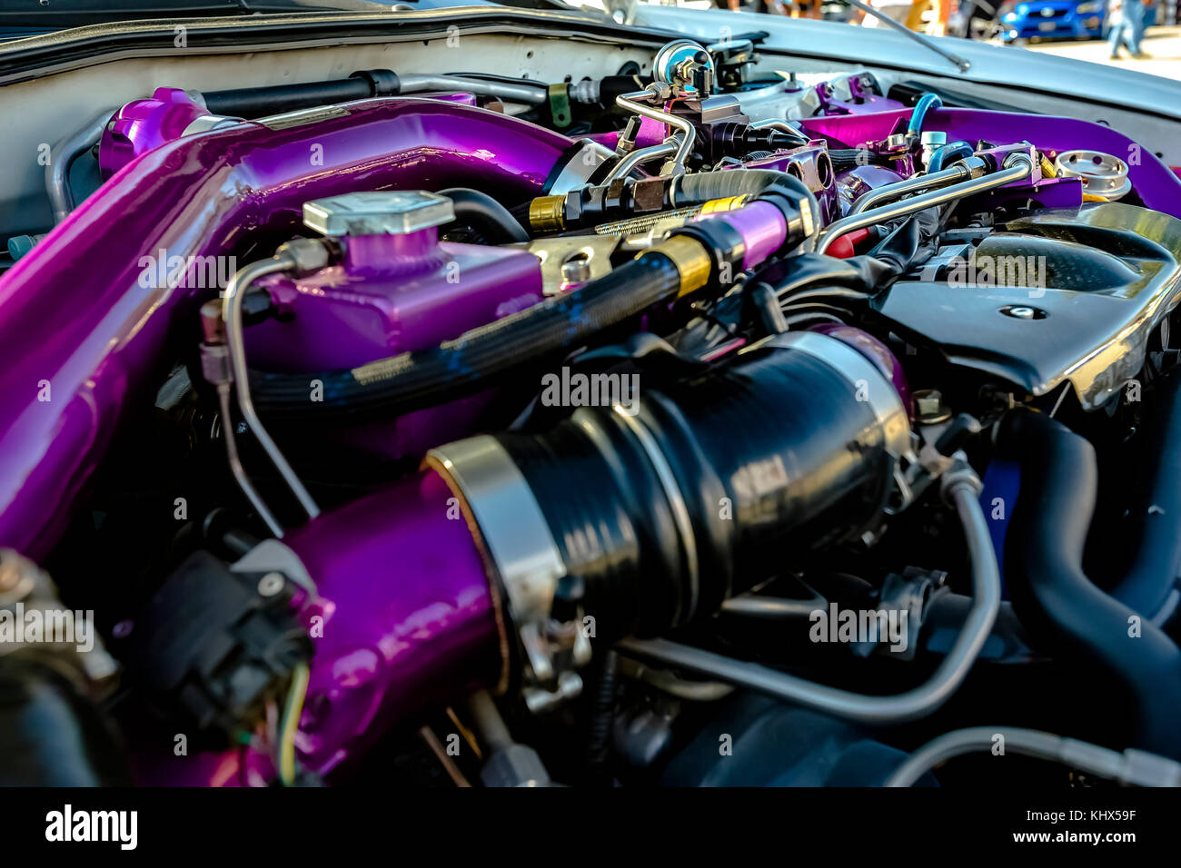 Purple pipes in a modern car. Engine and other mechanical components of
