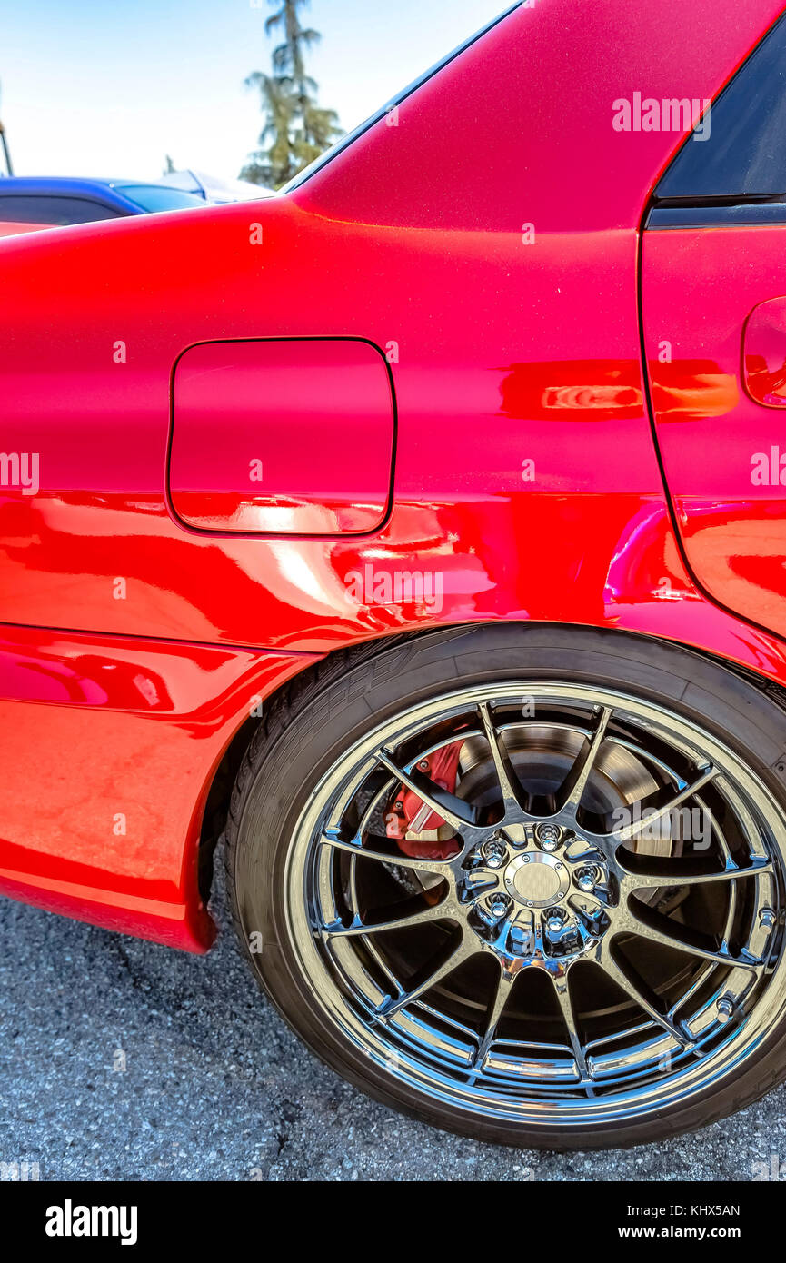 Red Car With Chrome Spokes And Red Break Pads Showing Between The Stock Photo Alamy