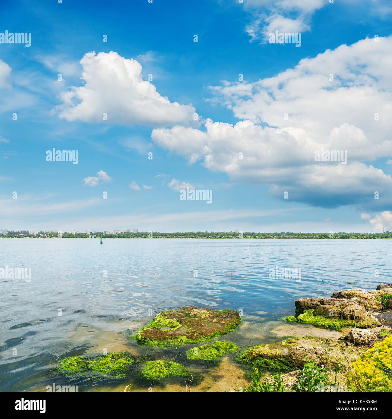 river closeup and clouds in blue sky Stock Photo - Alamy
