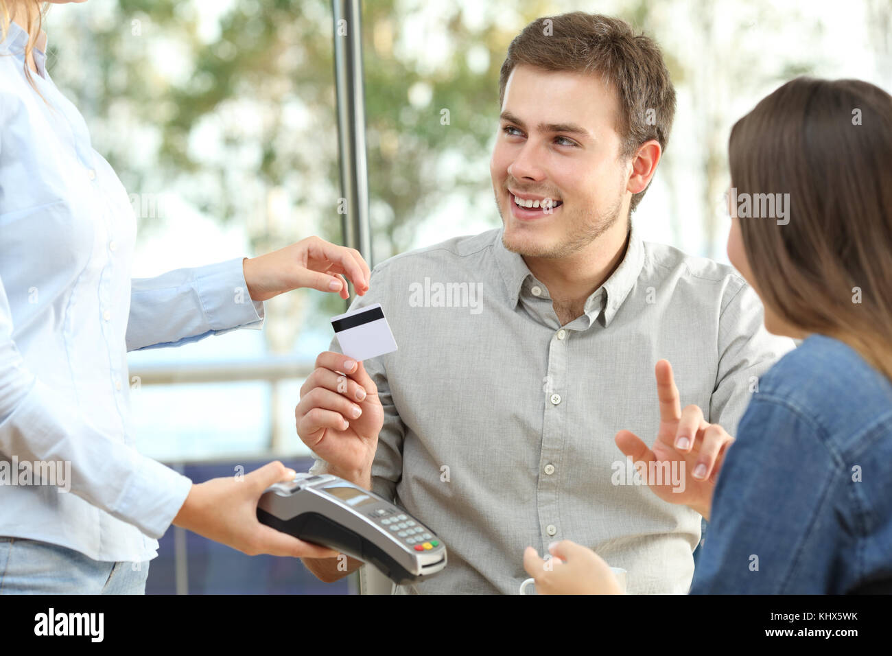 Couple ready to pay consumption with a credit card in a restaurant Stock Photo