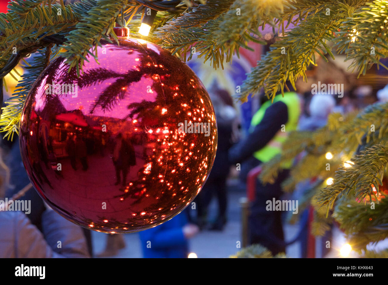Christmas tree ball hanging on a christmas tree with illumination at Cologne Cathedral Christmas Market. Stock Photo