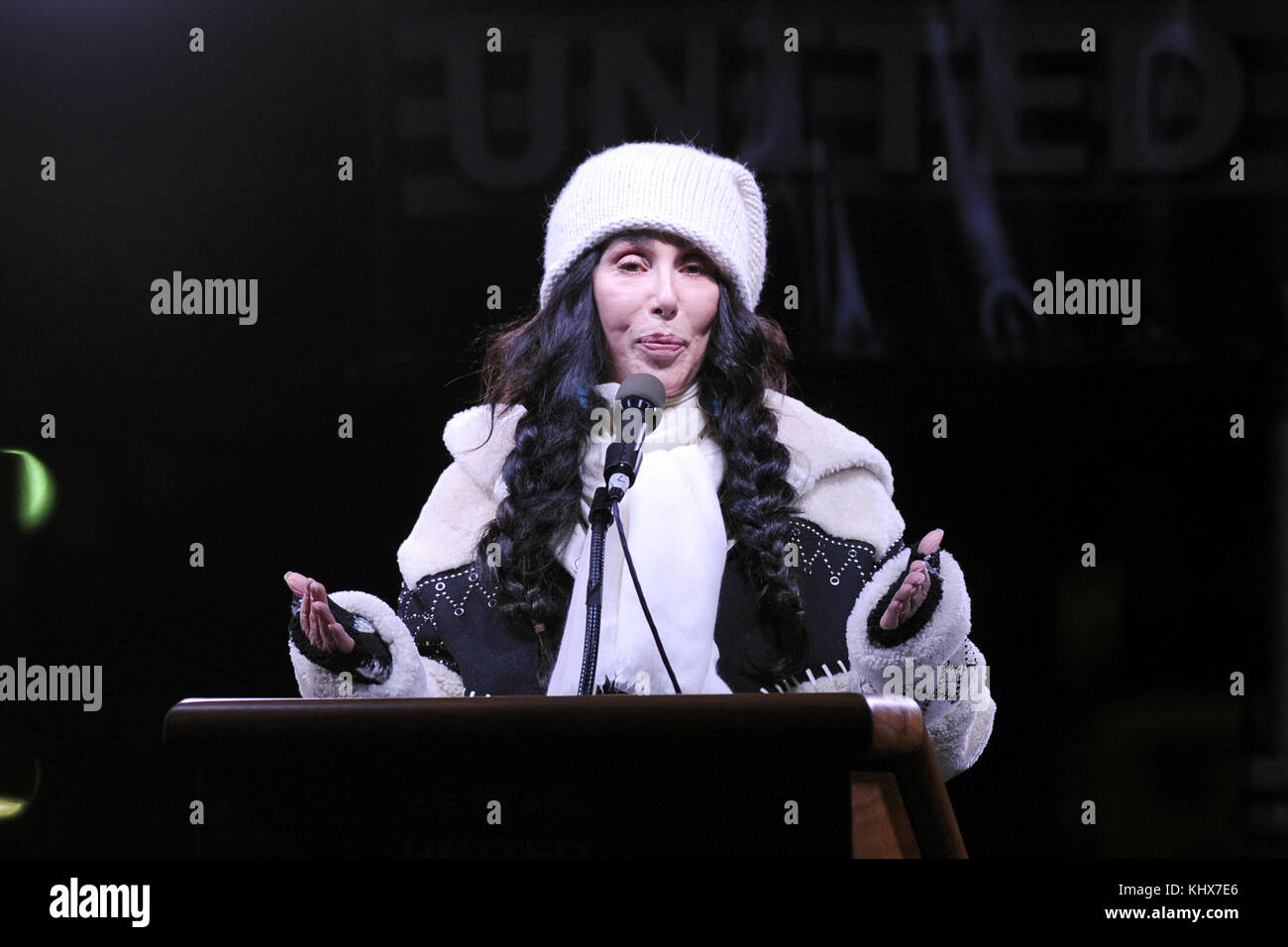 NEW YORK, NY - JANUARY 19: Cher gives a speech as people gather in front of Trump International Hotel & Tower in New York, USA on January 19, 2017 during a demonstration to protest US President-elect, Republican, Donald Trump ahead of his inauguration which will be held in Washington. Mayor of New York Bill de Blasio,Mayor of Minneapolis Betsy Hodges participate the protest as well as celebrities including Robert De Niro, Marisa Tomei, Sally Field, Alec Baldwin, Mark Ruffalo, Cynthia Nixon, Michael Moore, Cher, Natalie Merchant   People:  Cher Stock Photo