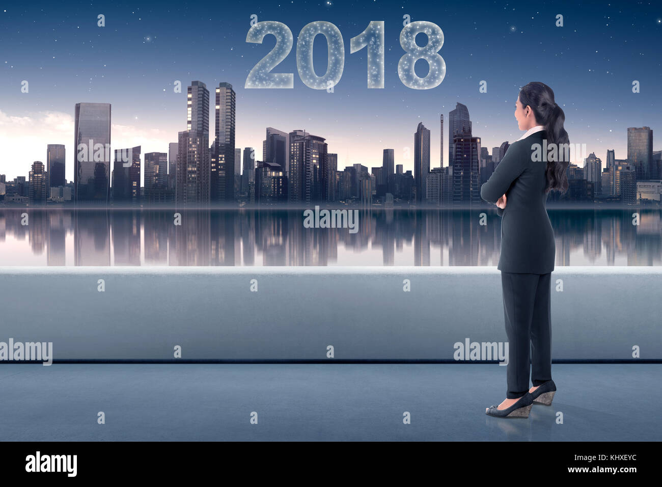 Young asian business woman looking at the city with star make 2018 ...