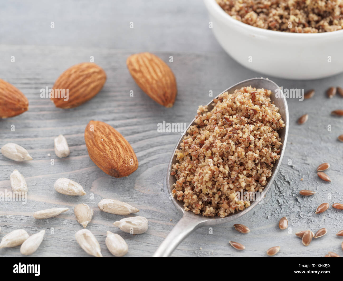 Homemade LSA mix in spoon Linseed or flax seeds, Sunflower seeds and