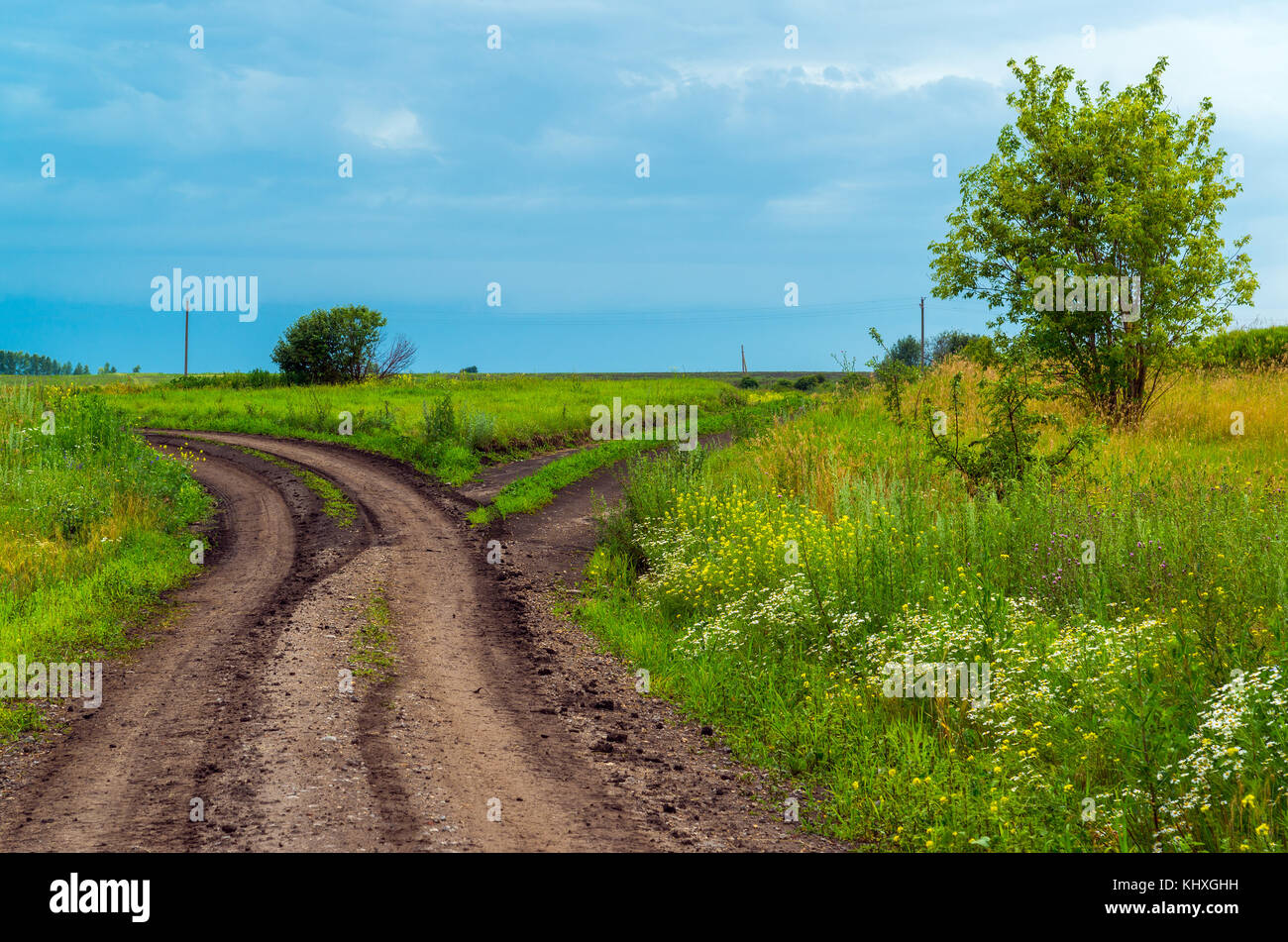 rural landscape with road and a stormy sky Stock Photo